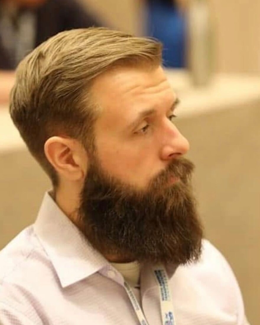 Daniel McGuire, Conductor Sentinel candidate, in side profile with a full beard